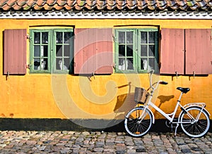 Bicycle in front of the entrance to an apartment in one of the h