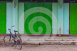 Bicycle in front of geen door,Nyaung Shwe in Myanmar (Burmar)