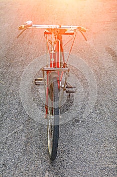 Bicycle Handle red classic vintage in former beautiful on the road with light sunrise tone