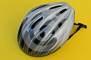 Bicycle helmet for cyclist.Protective helmet.Yellow background.