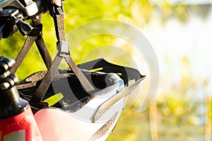 bicycle helmet on the handlebars of an e-bike at sunset in nature, cycling helmet