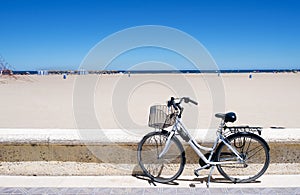 Bicycle in La Malvarrosa beach, Valencia, Spain photo