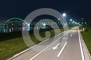 Bicycle lane and bridge at night