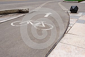 Bicycle lane marker in urban setting at daytime