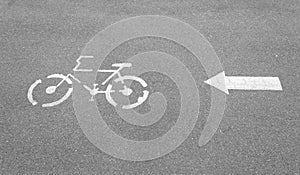 Bicycle Lane sign and arrow on concrete road
