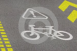 Bicycle lane sign on asphalt road. Concept of biking safety and active lifestyle. 3D perspective view at day time