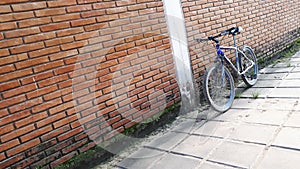 bicycle leaning against a brick wall.  Ideal for adding content
