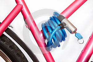 Bicycle lock is a security device used to deter bicycle theft, white background