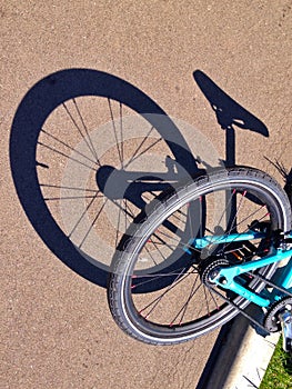 Bicycle lying down on ashpalt