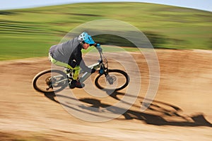 Bicycle, man and cycling in motion blur on dirt path for competition, fast power and off road adventure. Athlete, sports