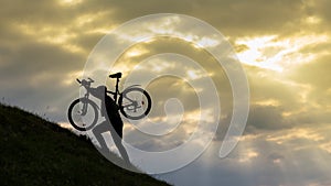 Bicycle man silhouette at sunset