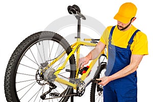 Bicycle mechanic adjusting front derailleur