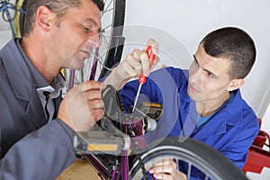 Bicycle mechanic working on mountain bike