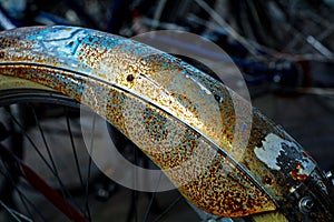 Bicycle mudguard with rust and remnants of stickers, detail, abs