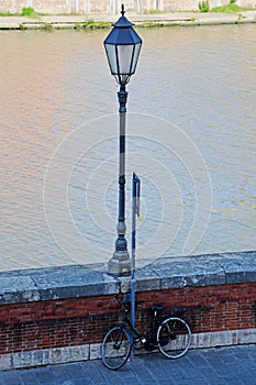 Bicycle and Old Street Lamp, River Arno, Tuscany, Italy