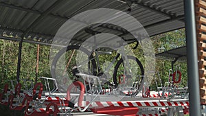 Bicycle parked in double-decker modern parking lot on second level. Bicycle infrastructure. Modern two level bicycle