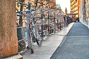 Bicycle parked on the European street at sunset