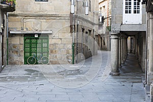 A bicycle parked in front of a closed shop