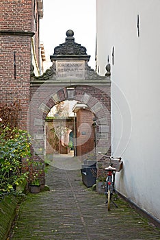 Bicycle parked at narrow street in Deventer, a typical Dutch scene