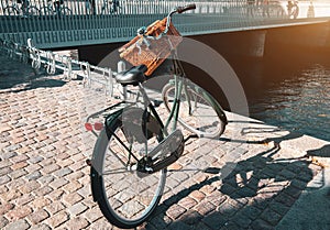 Bicycle parked near river canal in Copenhagen