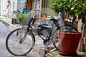 Bicycle parked near a street cafe