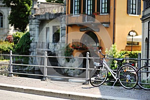 Bicycle parked on old cobblestone street in Como town, Lake Como, Italy, Europe