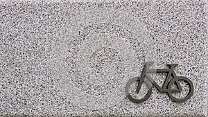 Bicycle parking area with bicycle sign on top of the concrete wall