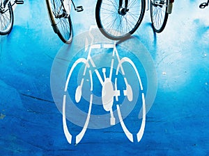 Bicycle parking area with bike pictogram symbol on ground