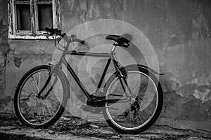 Bicycle parking at the old house in black and white
