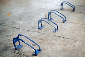 Bicycle parking in the park, Blue bicycle parking rack.