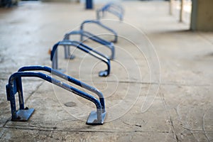 Bicycle parking in the park, Blue bicycle parking rack.