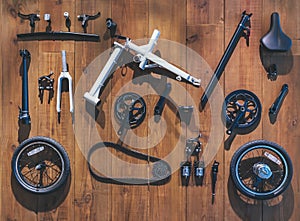 Bicycle parts lay on wooden wall background Flat lay equipment cycling tools
