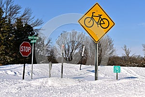 Bicycle path intersection buried with snow