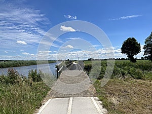 Bicycle path next to a canal around Basse
