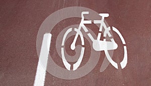 Bicycle path, two way cycling track with bicycle signs painted white photo