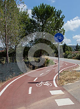 Bicycle path, two way cycling track with bicycle signs painted white photo