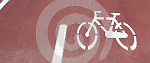 Bicycle path, two way cycling track with bicycle signs painted white photo