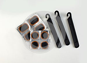 Bicycle puncture repair kit on a white