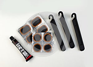 Bicycle puncture repair kit on a white