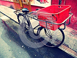 Bicycle with a red basket (Lomo feel) photo