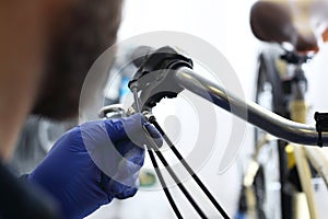 Bicycle repair spoof links on the brakes.