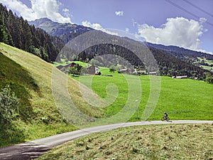 The bicycle rider in the Alps mountains