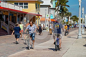 Bicycle rider at the Hollywood Beach Broadwalk in South Florida