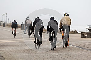 Bicycle riders on the dunes in Netherlands on a stormy day