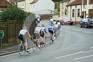 Bicycle riders training on town road