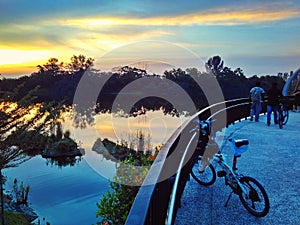 Bicycle at riverside bridge photo