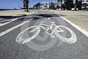 Bicycle road sign on bike path by sea in Villajoyosa, Spain photo