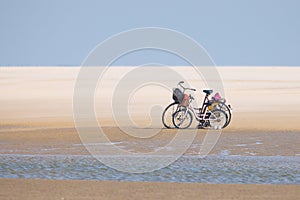 Bicycle on a Sandy Beach in Fano, Denmark photo