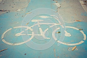 Bicycle sign on the cracked road