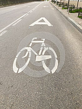 Bicycle sign on the road. Bicycle lane sign in the roadway. Place for cyclists to pass